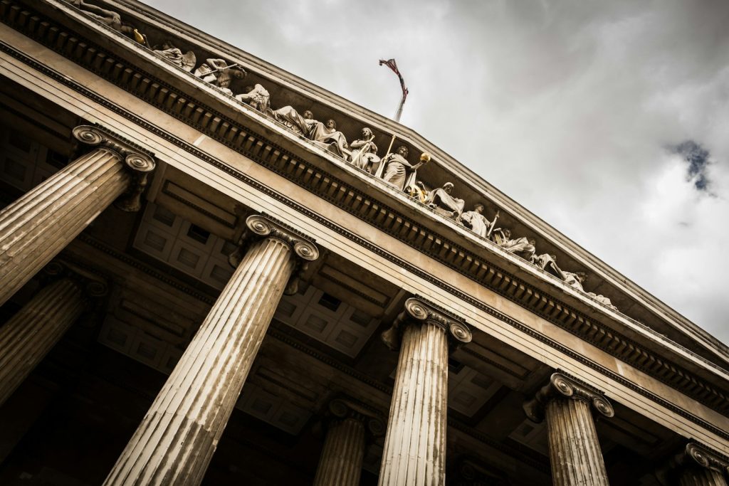 Neo-classical court building columns representing justice and accountability