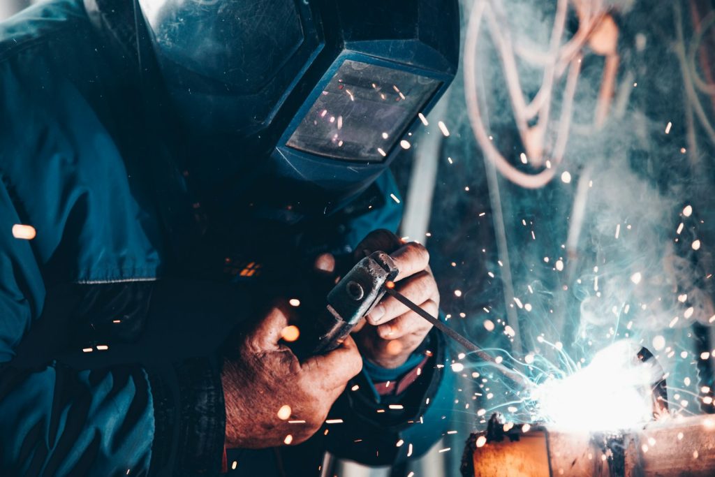 Industrial welding work representing occupational and industrial disease