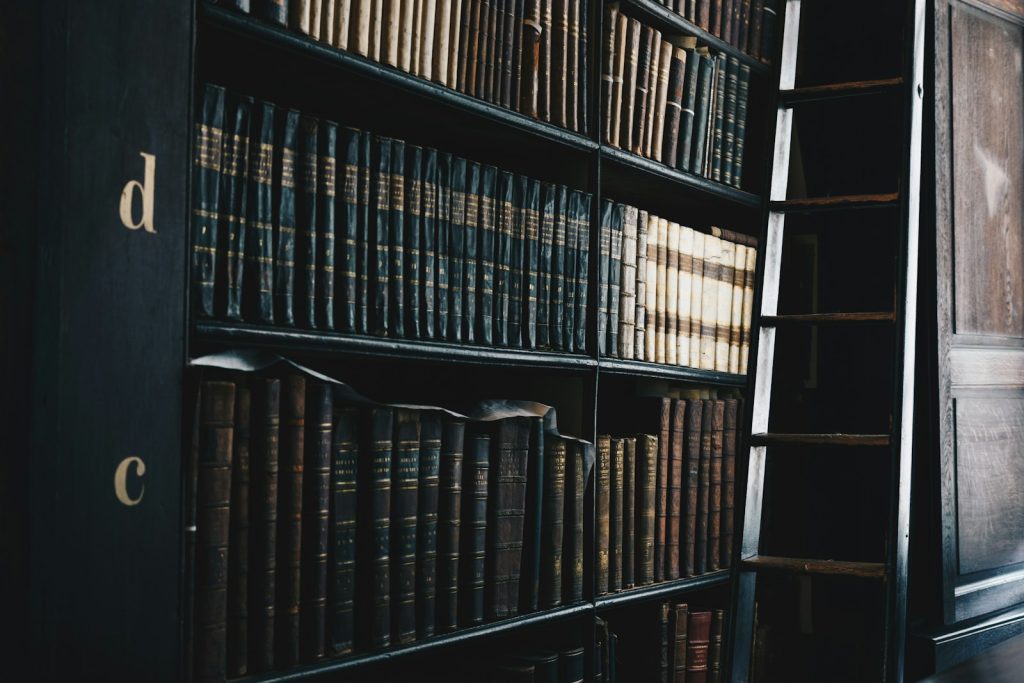 Rows of leather-bound law reports on a solicitor bookshelf