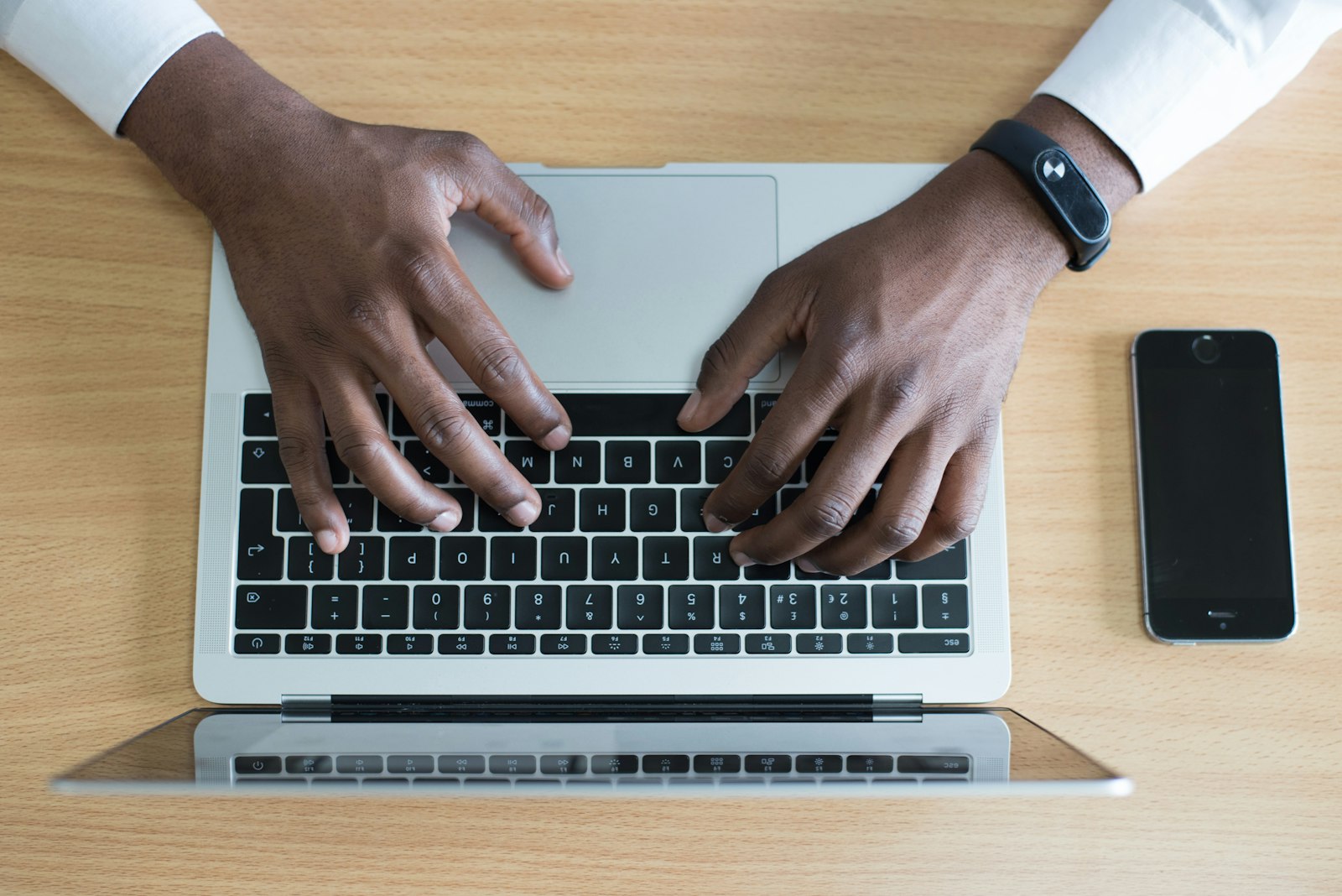 Hands typing on a laptop representing starting a no win no fee claim
