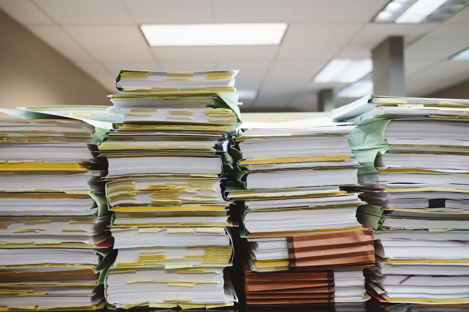 Stacks of case files and documents representing statutory will disputes